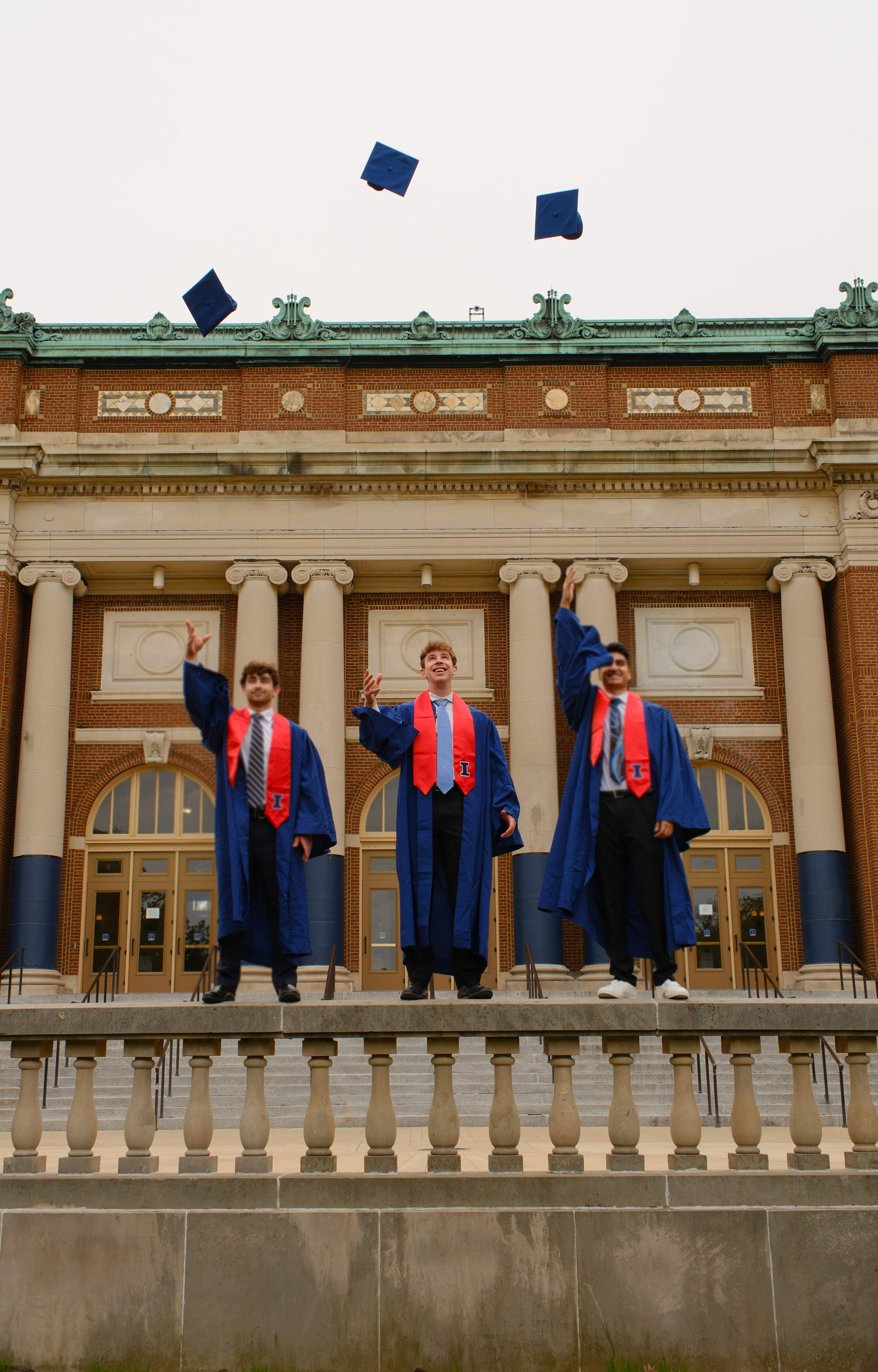 Lev throwing his graduation cap at the University of Illinois Urbana-Champaign